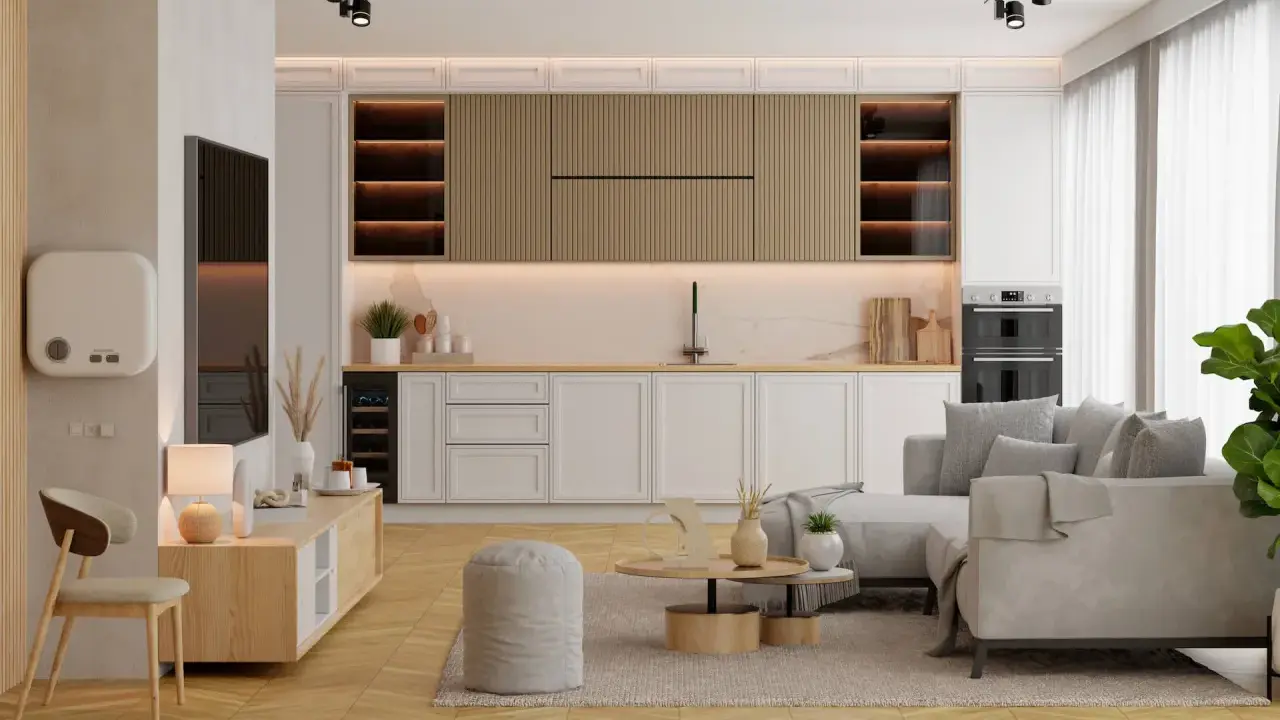 Mały salon z kuchnią aranżacje: jasne meble, szara sofa, drewniane akcenty i nowoczesne oświetlenie tworzą przytulną przestrzeń.