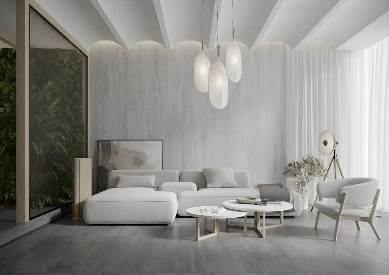 Nowoczesny salon z białymi meblami i kamienną ścianą. Wspaniały pomysł na sufit z łukami i delikatnym oświetleniem tworzy przytulną atmosferę.